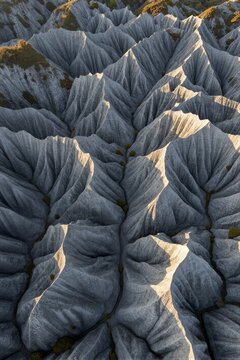 Majestic karst limestone formations in Romania's Babele Sphinx area reveal intricate patterns and textures under soft afternoon light.