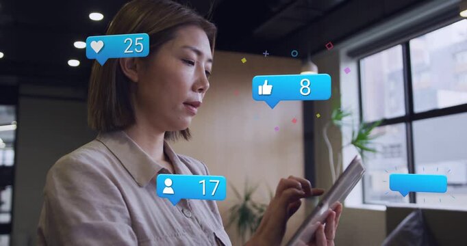 Woman tapping tablet and causing floating thumbs-up comment bubbles tracking rising social counts
