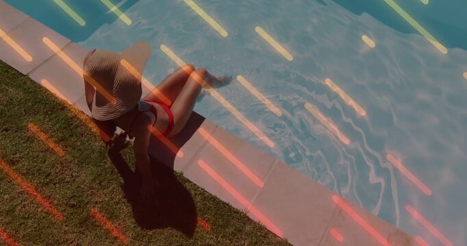 Woman sitting pool edge starting shifting, dipping toes, relaxing, neon streaks framing promo