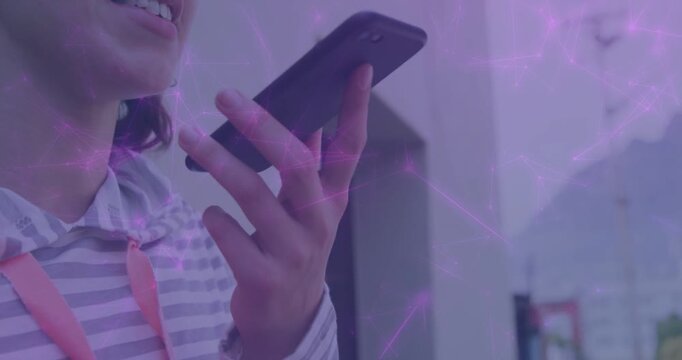 Woman raising phone at mouth and sending voice note for tech purple network overlay circling phone
