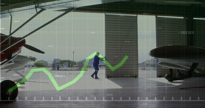 Approaching hangar door, tech in blue coveralls pushing panel past prop planes revealing ramp HUD