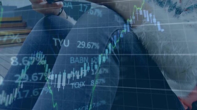 Woman sitting, tapping smartphone on wooden deck while financial charts filling frame