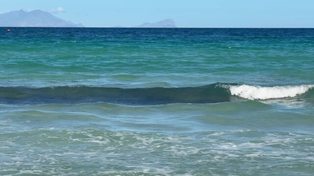 The view across False Bay from Glencairn beach near Fish Hoek, Cape Town.