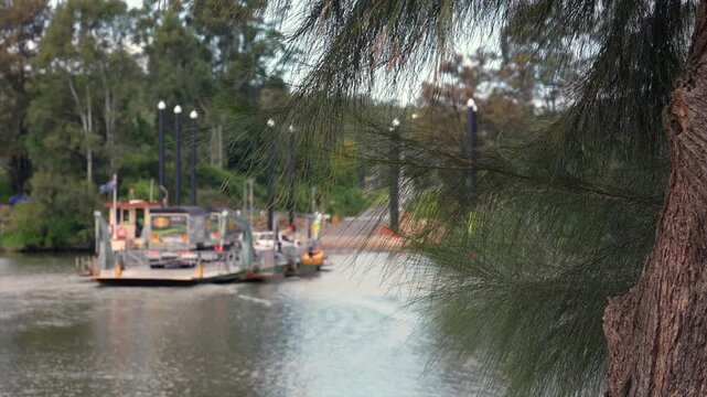 Sackville ferry out of focus in the background crossing the Hawkesbury river, New South Wales, Australia