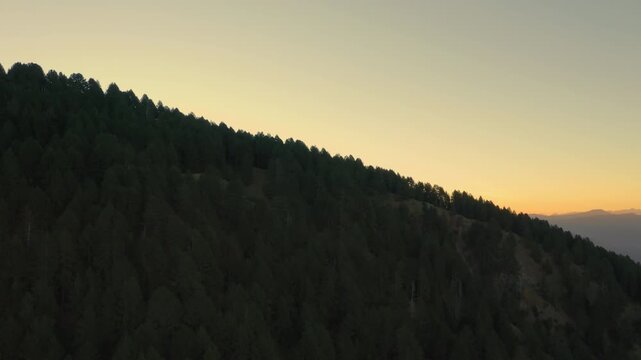 Aerial view of Peaceful dawn scene of Sunrise over forested Pindus mountains in Epirus, Greece