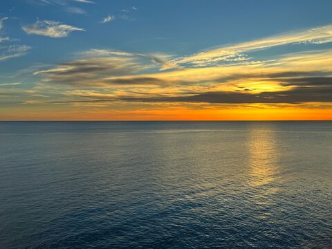Sunset sky above calm sea. 