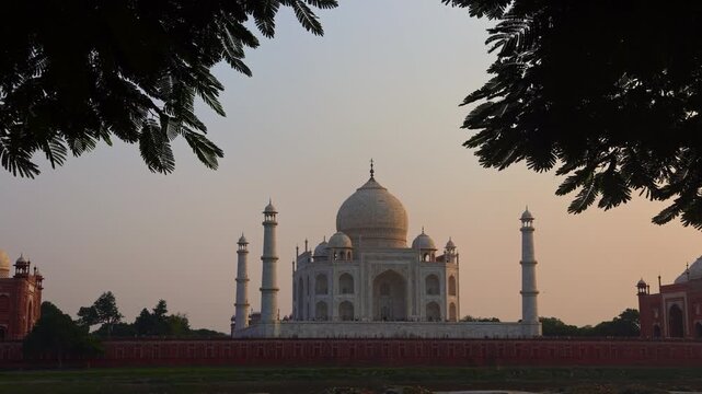 White marble mausoleum with symmetrical Mughal architecture
