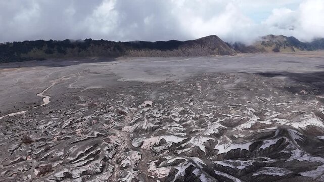 Wide aerial drone view of Mount Bromo caldera and volcanic landscape 