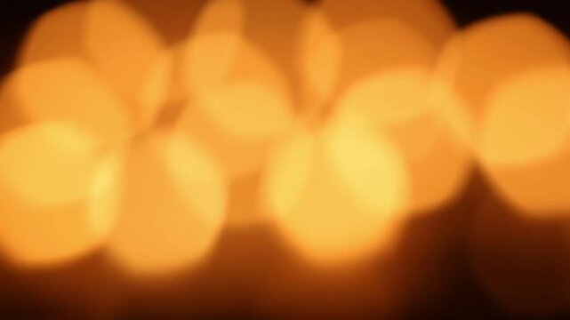 Bright golden bokeh circles form a dense horizontal band , remaining softly defocused with subtle shimmer across frame, suggesting festive lighting and elegant abstract background.