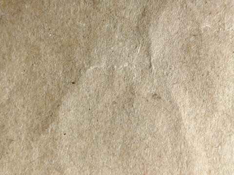 Textura de papel kraft marr&oacute;n arrugado con superficie granulada natural