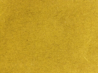 Fototapeta premium Textura de papel de color amarillo mostaza con fibras naturales