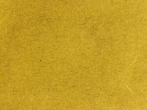 Textura de papel de color amarillo mostaza con fibras naturales