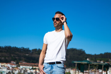 Fototapeta premium Casual man strolling on a sunny day