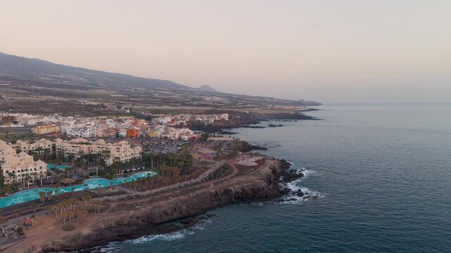 Aerial view of Costa Alcala, Tenerife at sunset with calm ocean waves