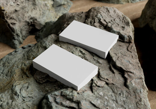 Two business card stacks on rocks at the beach Mockup - 3D rendering