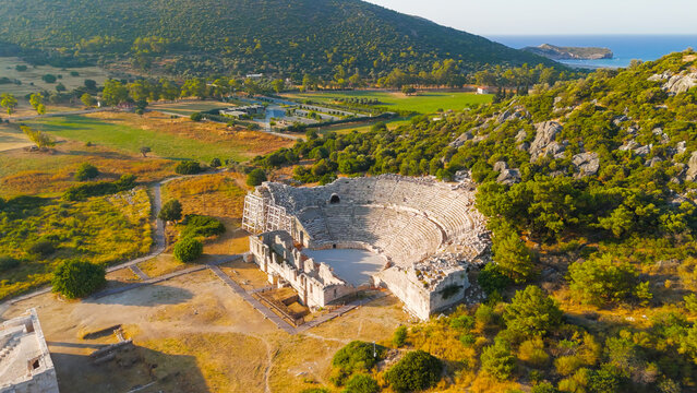 Gelemis, Turkey. Patara Ancient Theatre with 6000 capacity on Kursunlu Hill, monumental roman structure in summer morning. Aerial View
