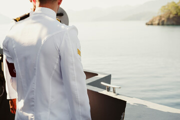 mariner of turkish naval forces in white uniform standing on ship deck during open day event © Ela