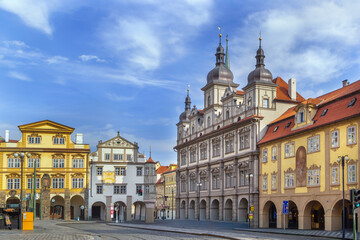 Obraz premium Malostranske Square in Prague city centre, Czech Republic. Historical baroque architecture under partly cloudy blue sky