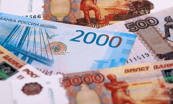 Russian ruble money bills pile on table. Russia banknotes of RUB currency close up.
