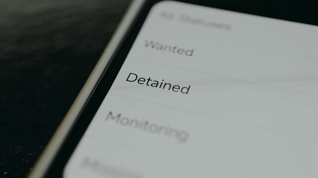 Police database system displaying status of criminals, wanted, detained, monitoring, missing