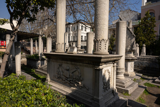 Historic cemetery in Istanbul featuring traditional Ottoman graves,