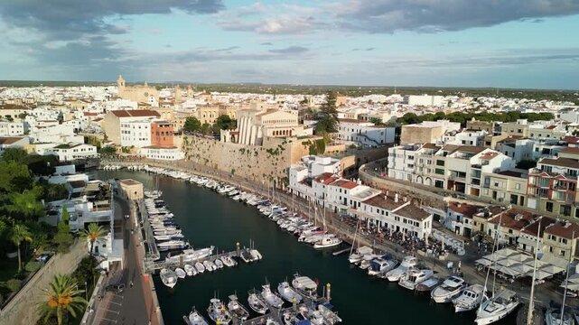 Aerial drone view over the historic city center of Ciutadella, Menorca Island, Balearic islands, Spain. Medieval buildings. Marina port and boats