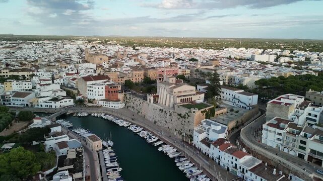 Aerial drone view over the historic city center of Ciutadella, Menorca Island, Balearic islands, Spain. Medieval buildings. Marina port and boats