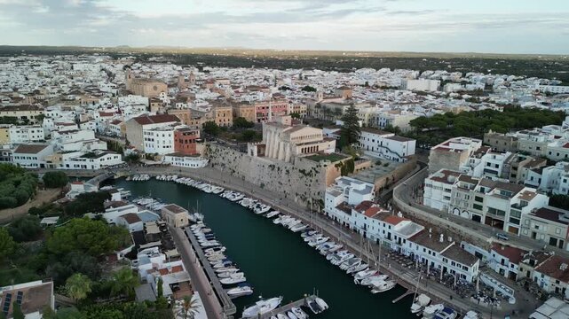 Aerial drone view over the historic city center of Ciutadella, Menorca Island, Balearic islands, Spain. Medieval buildings. Marina port and boats