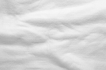 Fototapeta premium White cotton fabric as background, top view