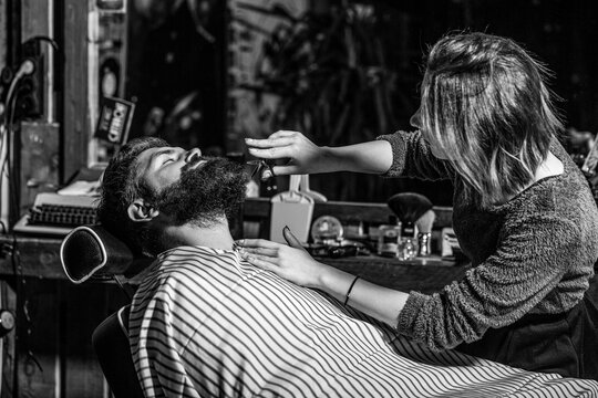 Barbershop. Hairdresser, hair salon. Bearded man. Barber scissors, barber shop. Vintage barbershop, shaving. Black, white