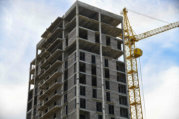 Fototapeta premium The construction site of a multi-storey building in an urban environment.