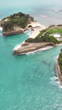 Famous Canal d'Amour beach in Sidari, Corfu Island. Beautiful Mediterranean coastal landscape with crystal clear blue water, yellow cliffs, and summer vacation vibes in the Greek islands.