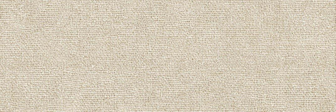This close-up shot shows the detailed texture of an ecru denim fabric with a visible weave and subtle pilling. The light beige material provides a neutral and organic background.