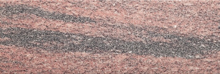 Plakat A detailed view of a leathered pink granite stone texture featuring wavy bands of dark grey and black minerals across a speckled reddish surface suitable for background use.