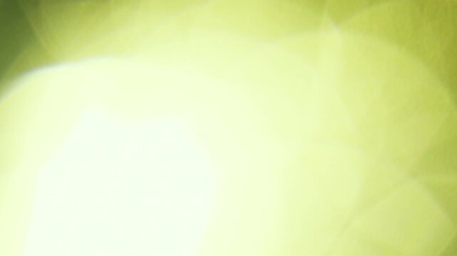 Golden bokeh light overlay with glowing lens flare texture for fast cinematic video transitions