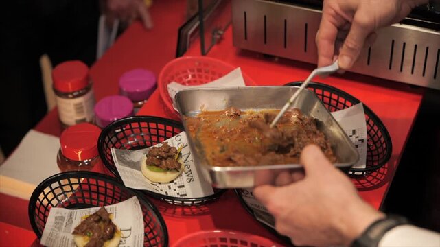 Close-up of a chef&rsquo;s hands preparing meat bao buns