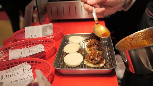 Close-up of a chef&rsquo;s hands preparing meat bao buns
