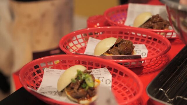 Close-up of a chef&rsquo;s hands preparing meat bao buns