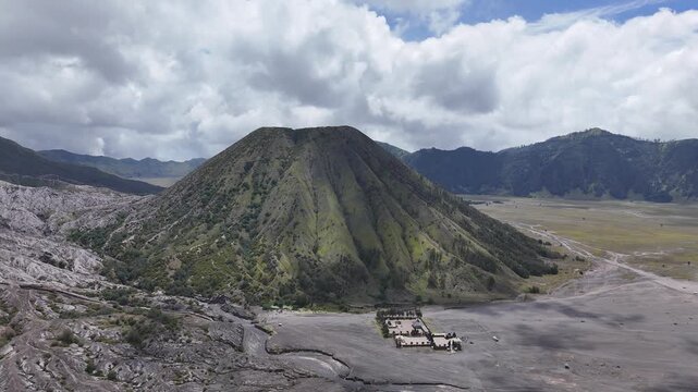 Drone flying sideways around Mount Batok, Bromo caldera