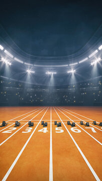 Athletics running track at a sports stadium with glowing spotlights and fans ready for the upcoming night sporting event.