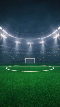 Football and soccer field at a sports stadium with glowing spotlights and fans ready for the upcoming night sporting event.