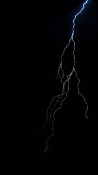 Vertical screen dynamic of vibrant lightning strikes illuminating  black background