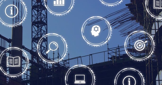 Silhouetting tower crane mast and metal scaffolding at urban site, showing rebar and digital icons