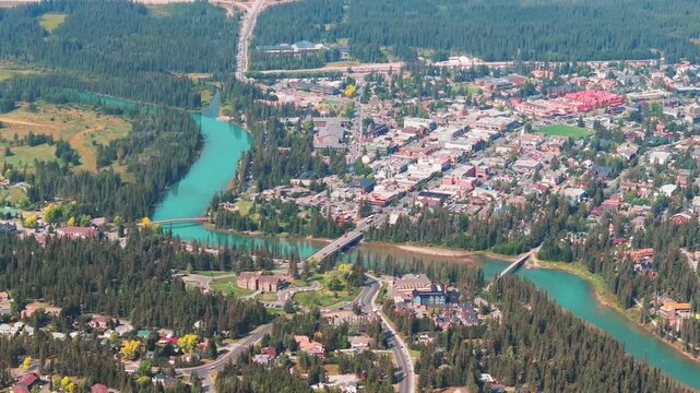 Aerial Revealing shot, Town of Banff, Morning shot. Banff National Park, Alberta, Canada.