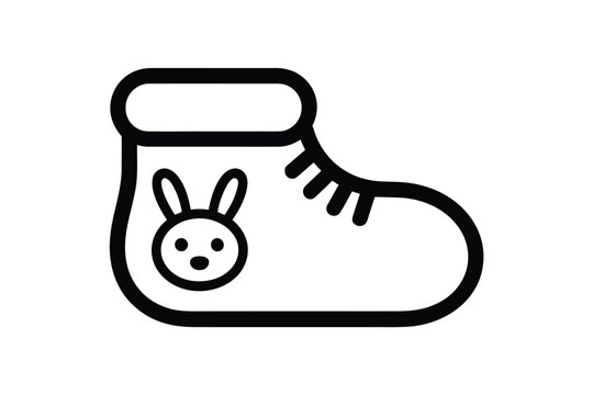 A simple black and white illustration of a baby bootie with a cute bunny face