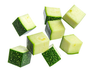 Falling zucchini cubes isolated on white background, group of flying courgette dice with motion for healthy cooking and food preparation compositing