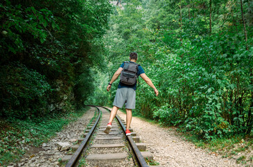 Obraz premium old railway without a train and without people in the forest in the mountains