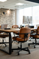 Fototapeta premium Modern open plan office space with unoccupied desks