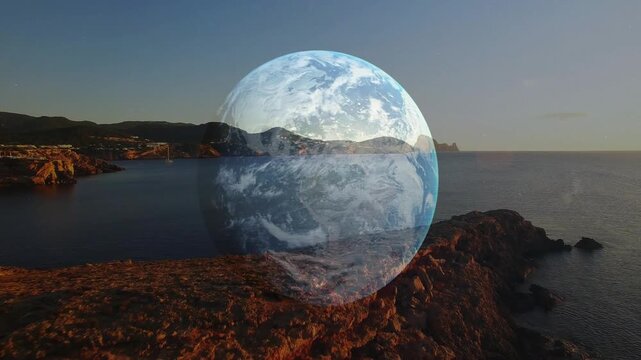 Coast appearing at dusk, translucent globe fading in and rotating, revealing cliffs for environment