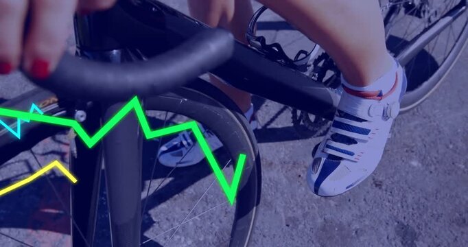 Woman cyclist gripping bars placing foot on pedal and pedaling for training neon lines syncing